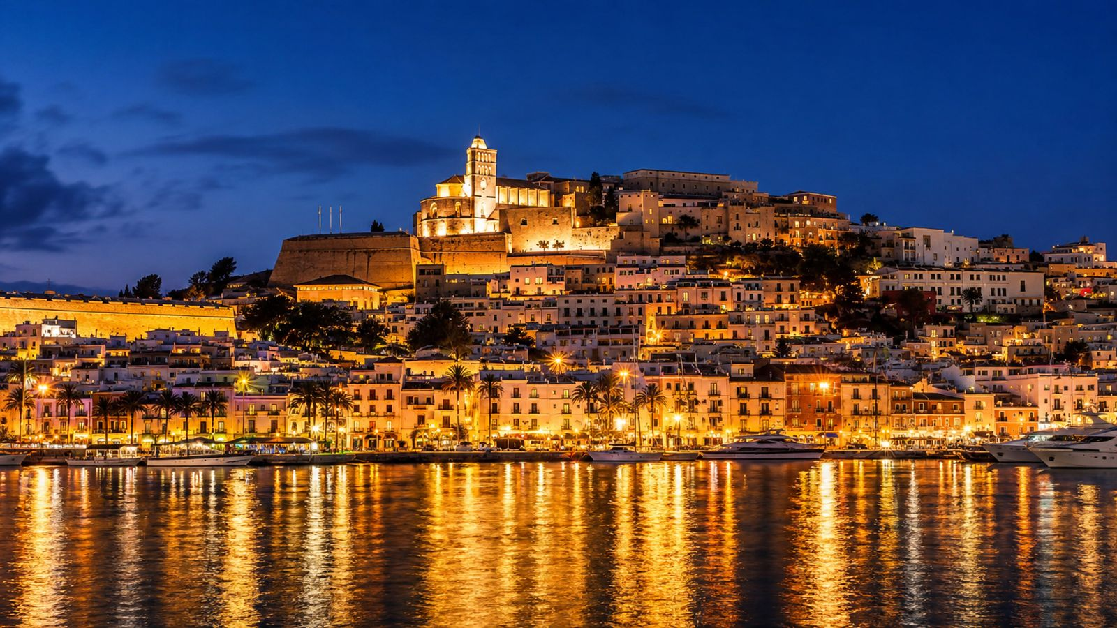 Es Vedrà seen from an Ibiza clifftop at sunset